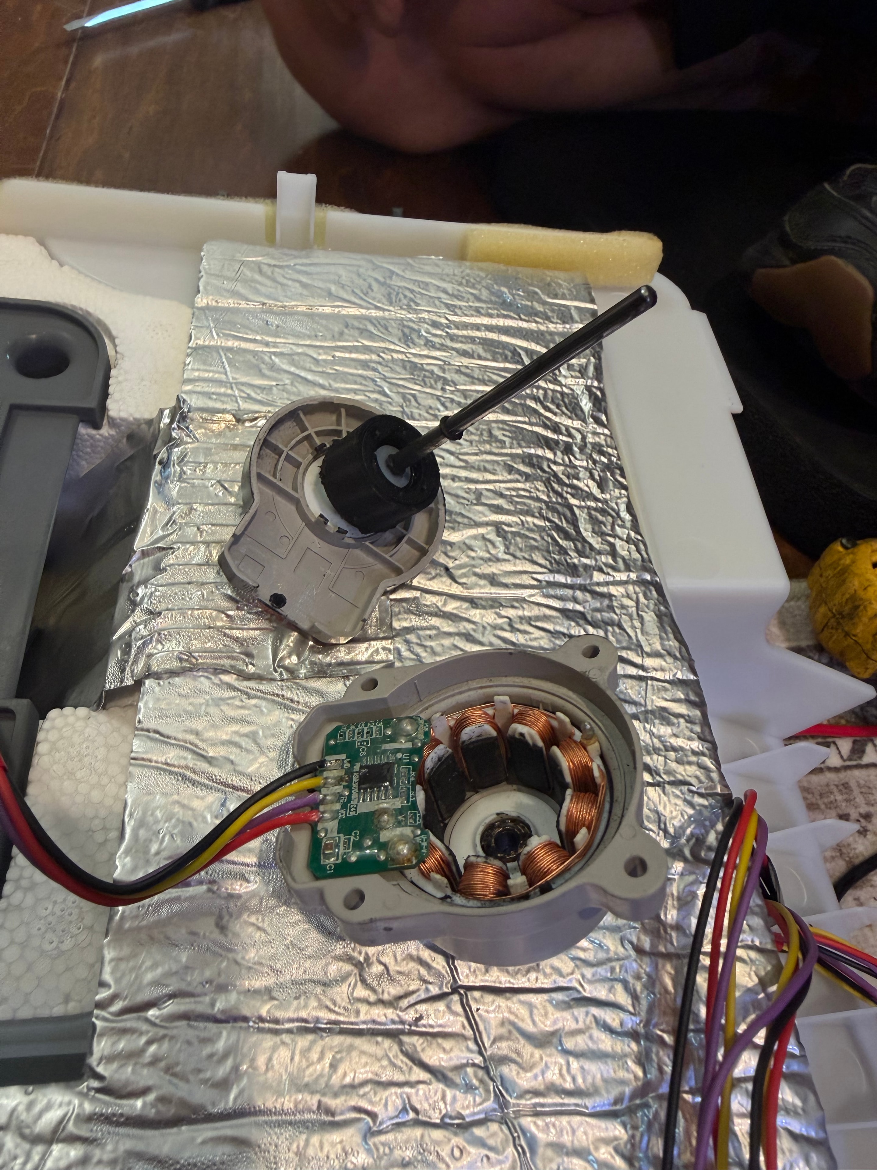 Failed LG ice room evaporator fan motor (left) next to new OEM replacement EAU65058313 (right)
