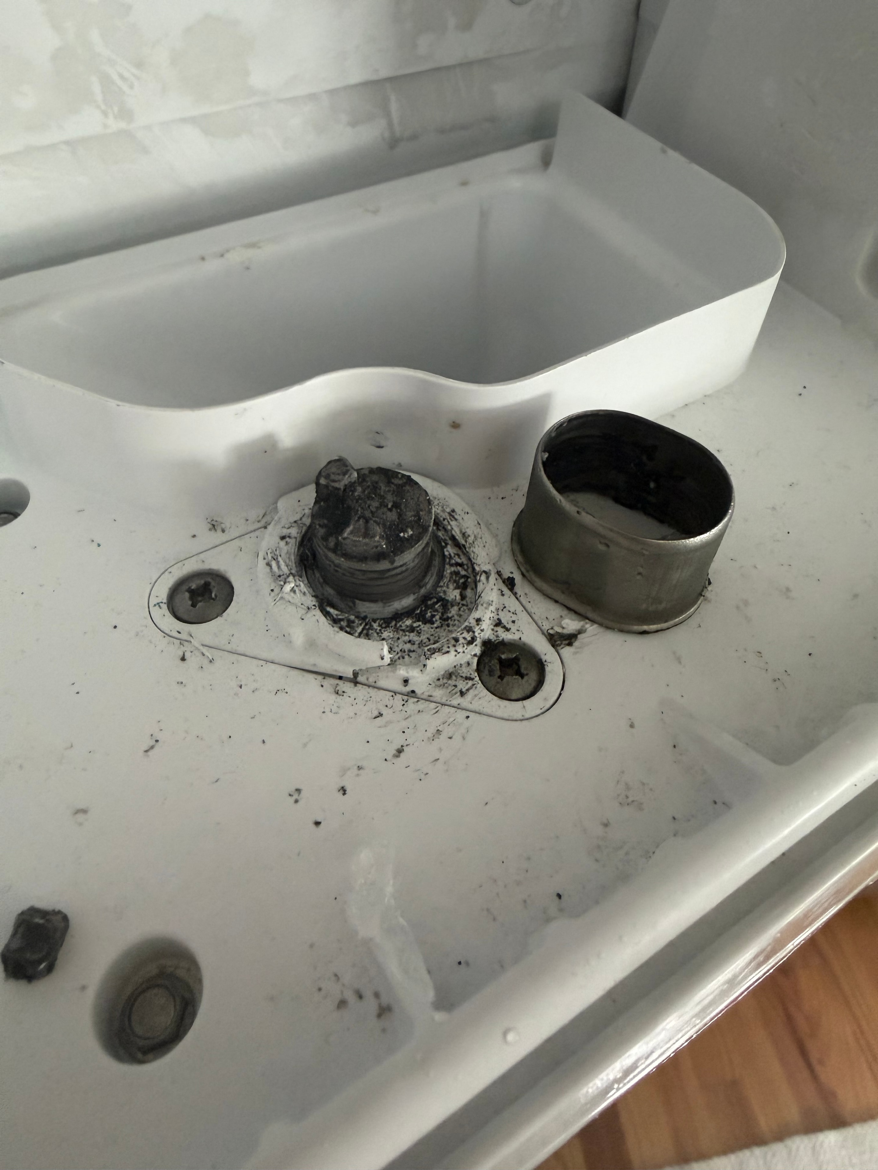 Broken auger coupling and worn ice chute assembly found during Whirlpool repair — Skyland Denver