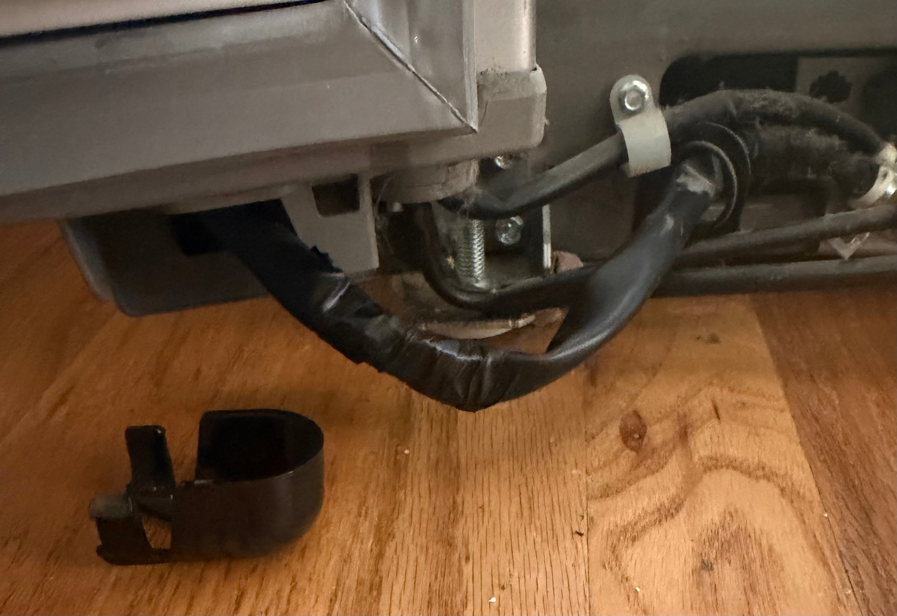 Freezer door wiring harness reinforced and protected on Whirlpool refrigerator — Skyland Denver