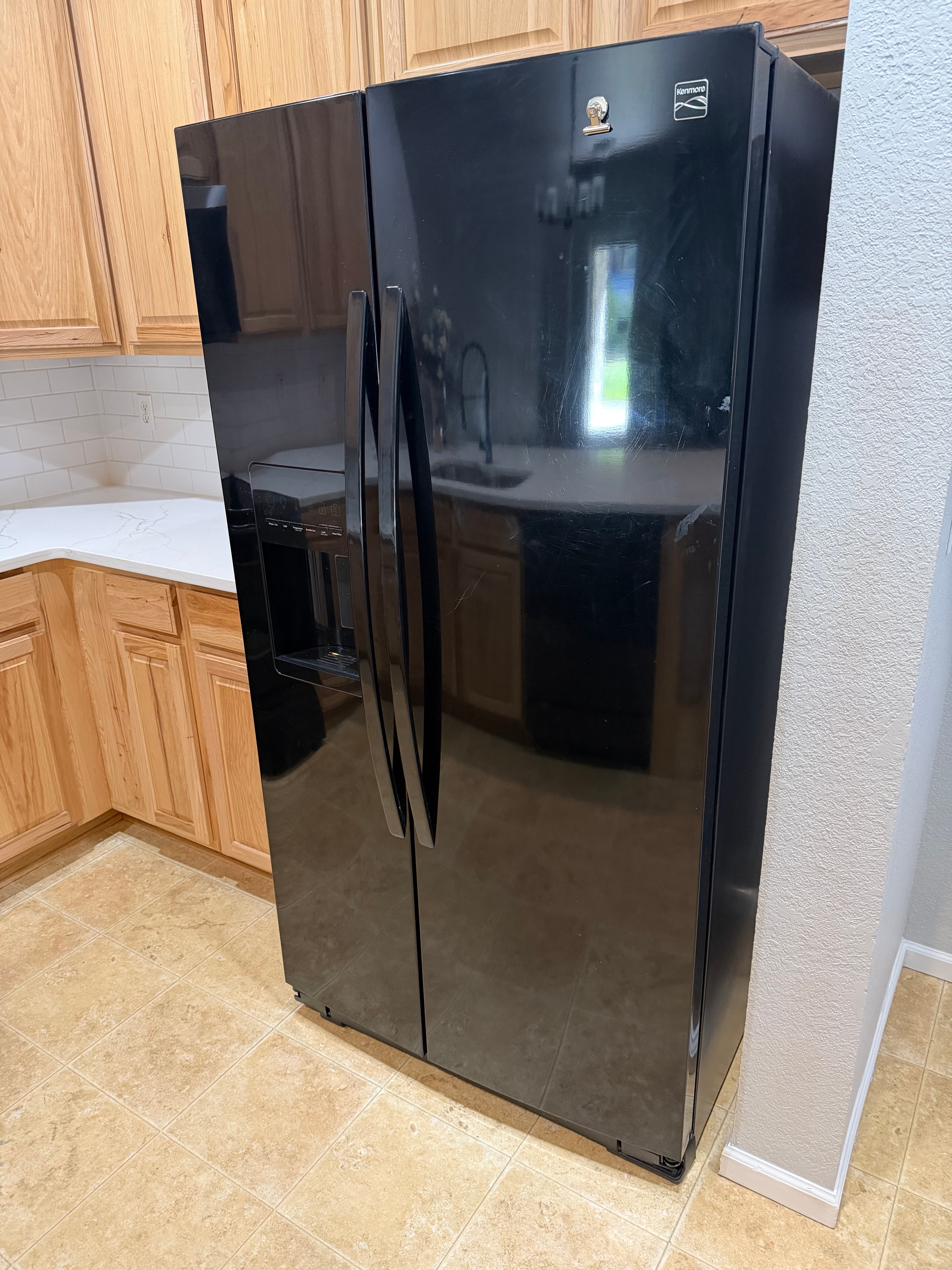 The Whirlpool side-by-side refrigerator in the customer's kitchen