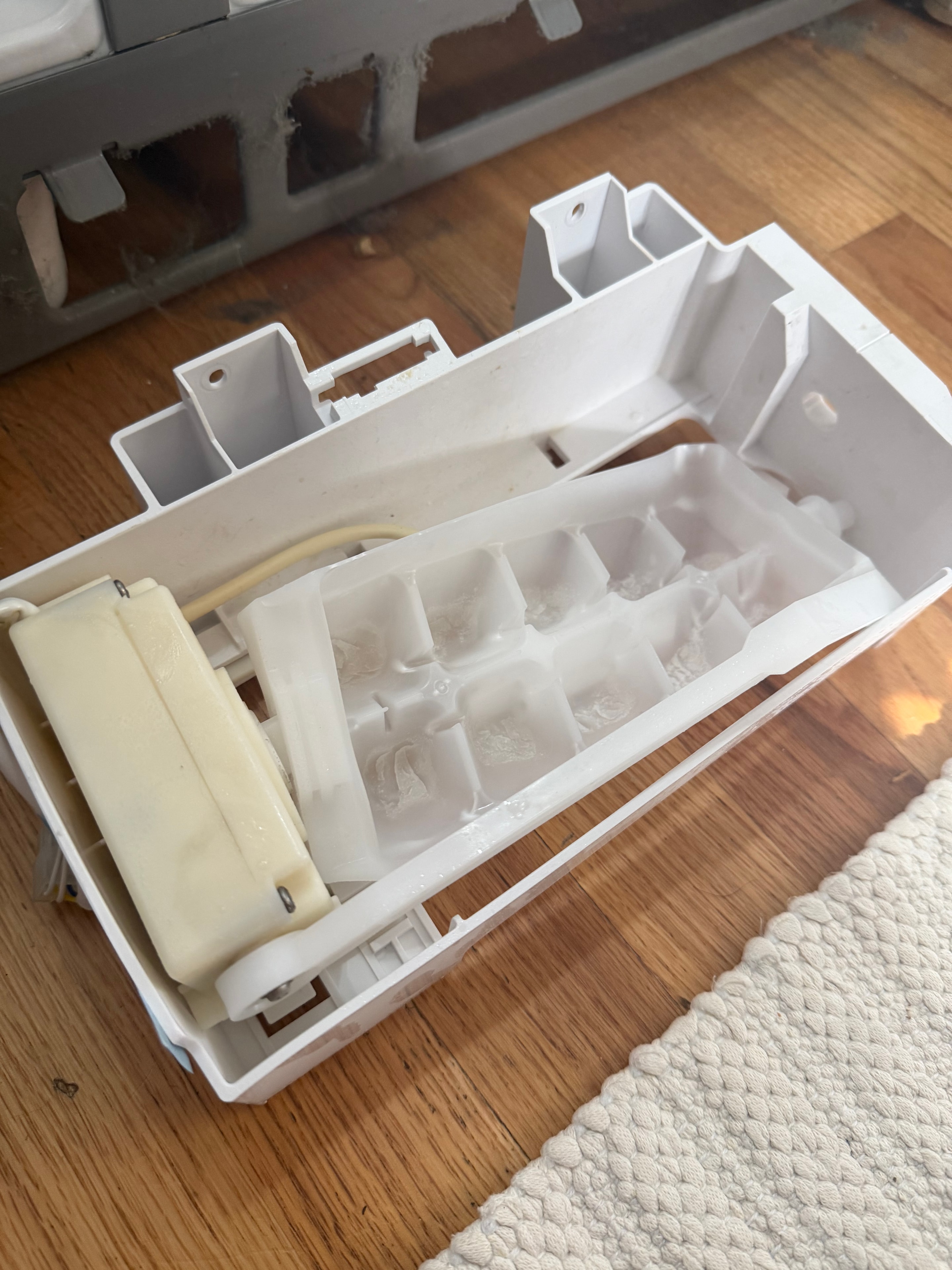 Failed Whirlpool ice maker removed from the refrigerator — Skyland Denver
